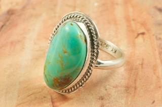 Genuine Manassa Turquoise set in Sterling Silver Ring. This Turquoise is also referred to as King�s Manassa Turquoise. The Manassa Turquoise mine is located in Manassa, Conejos County, Colorado. Created by Navajo Artist Kathy Yazzie. Signed by the artist.